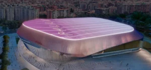 Render exterior del nuevo Palau Blaugrana con cubierta curva iluminada por la noche