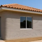 Vivienda impresa en 3D en México, arquitectura de concreto con textura visible y entorno natural